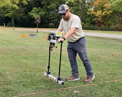 Researcher testing non-invasive methods of identifying graves.